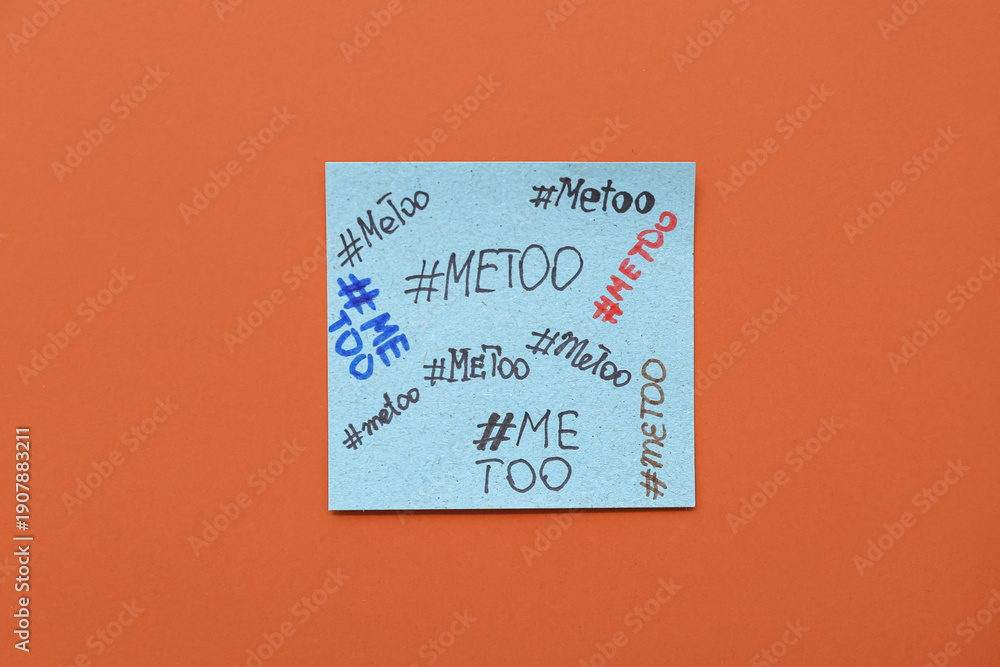 Naklejka premium Paper with hashtags METOO on orange background