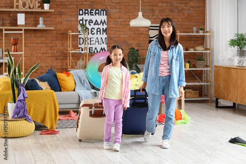 Young Asian mother and her ...