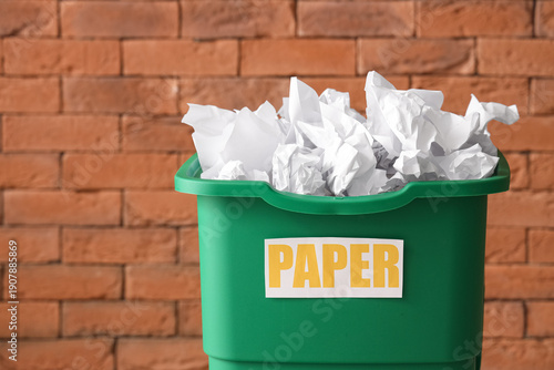 Green recycling bin with pa...