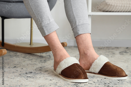 Man in soft slippers relaxi...