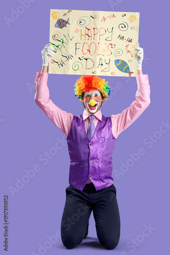 Portrait of clown holding p...