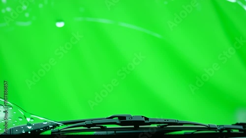 Car Windshield Wipers Wiping Rain Water on Green Screen