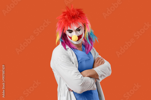 Young man as clown doctor o...
