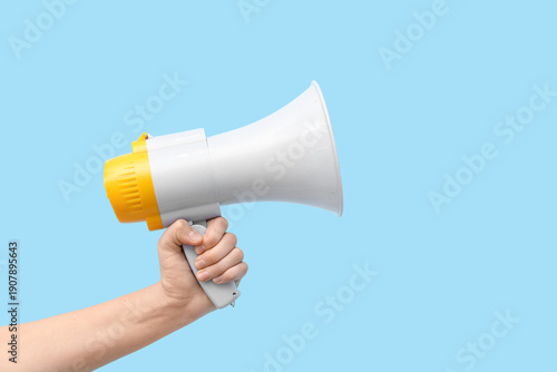 Female hand with megaphone ...