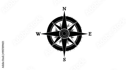 A black and white image of a compass rose. The cardinal directions are indicated