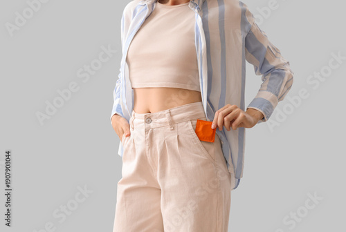 Young woman with condom in ...