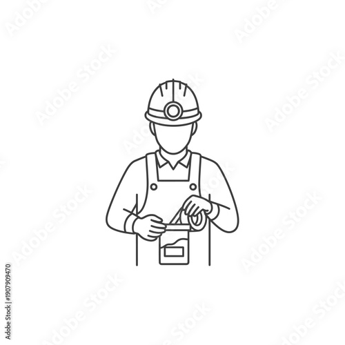 Laborer preparing construction adhesive or mortar in a mixing container