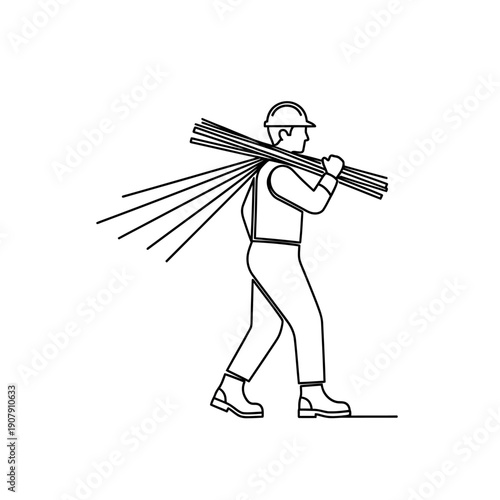 Construction laborer carrying steel reinforcement rods on shoulder