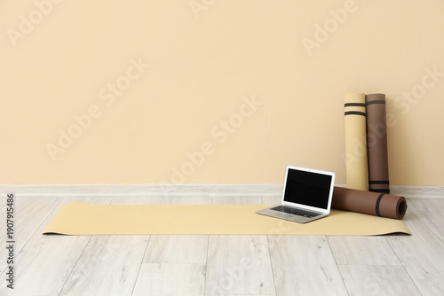 Laptop with fitness mats ne...