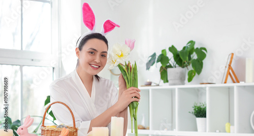 Young woman with bunny ears...