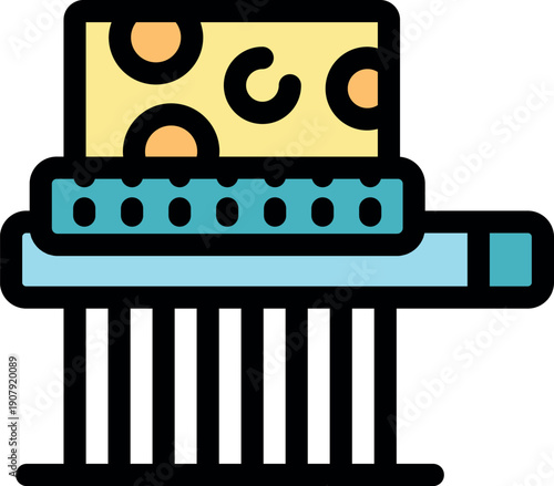 Colorful cheese grater holding a block of swiss cheese