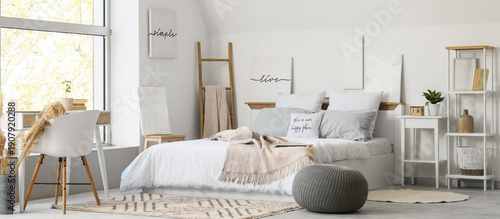 Interior of light bedroom w...