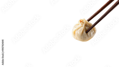 Steamed dumpling held with chopsticks isolated on transparent background cut out