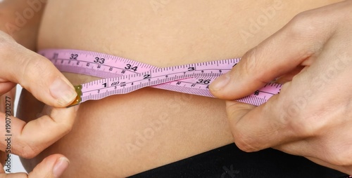 Wallpaper Mural Measuring waist circumference with a tape measure Torontodigital.ca