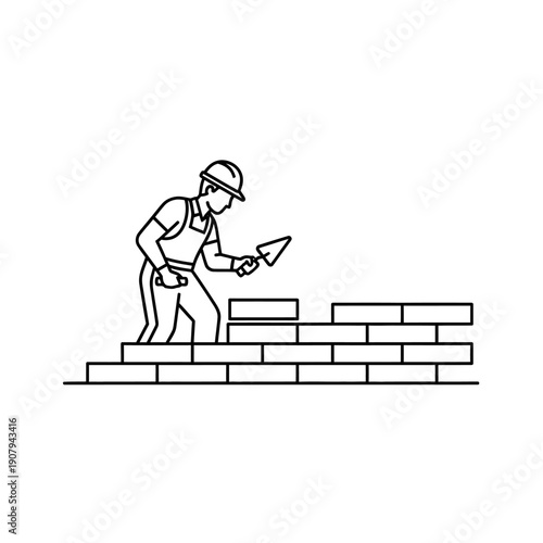 Masonry worker building brick wall with mortar trowel