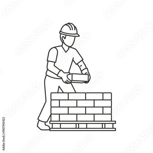 Masonry worker stacking concrete blocks on a wooden pallet for transport