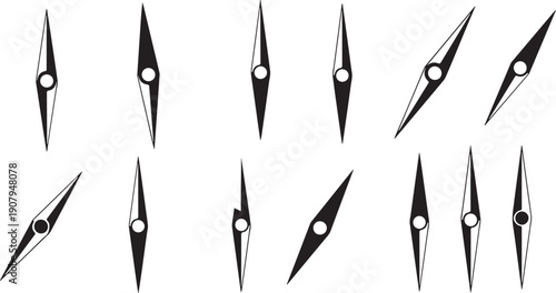 Collection of black and white sewing machine needles displayed