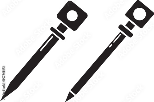 Silhouette of two wooden stakes for gardening works