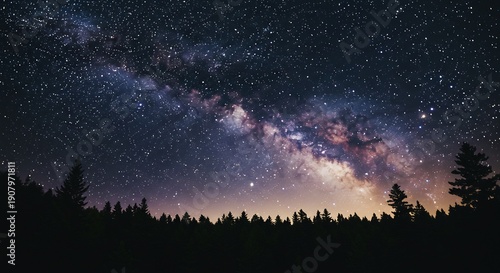 静寂な夜の森を背景に無限に広がる天の川が宇宙の輝きを放つ神秘的な星空. AI Generated