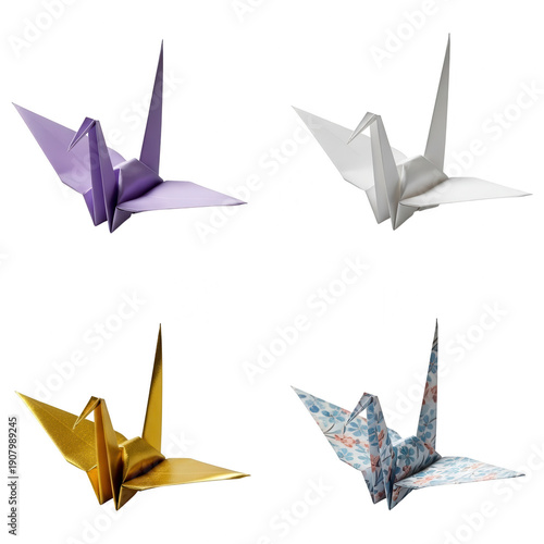 Origami paper cranes in various colors and patterns: purple, white, gold, and floral print, symbolizing peace and hope