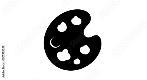 A stylized black and white palette with circular compartments for paint colors