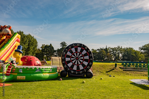 Colorful inflatable attractions providing fun and entertainment for children and adults at outdoor events.