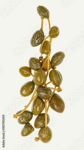 Pickled Capers Isolated on White Background, Small Green Flower Buds Preserved for Culinary Flavor and Gourmet Seasoning Concept