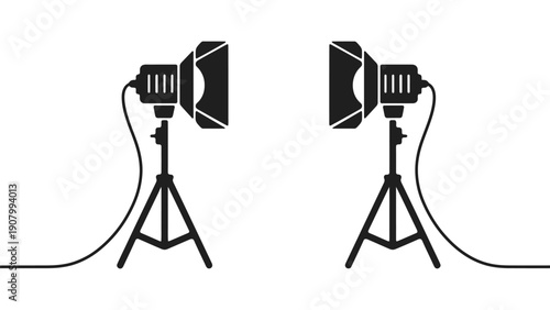 Two studio lighting stands are set up for a photoshoot.