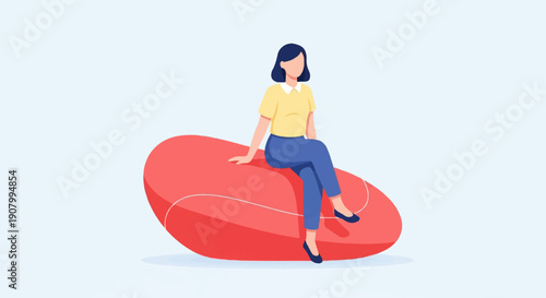 Woman relaxing on a large red beanbag chair against a light blue background