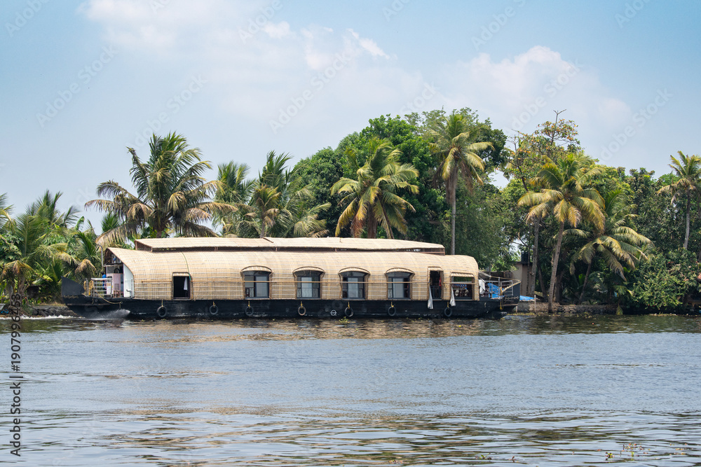 Obraz premium Alleppey backwaters in India, Alappuzha houseboats on waterway, small canal of Laccadive Sea, Tarshish land of Kerala, serene water body