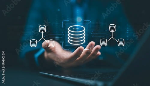 Person holds digital icon of distributed database system, representing data management and network