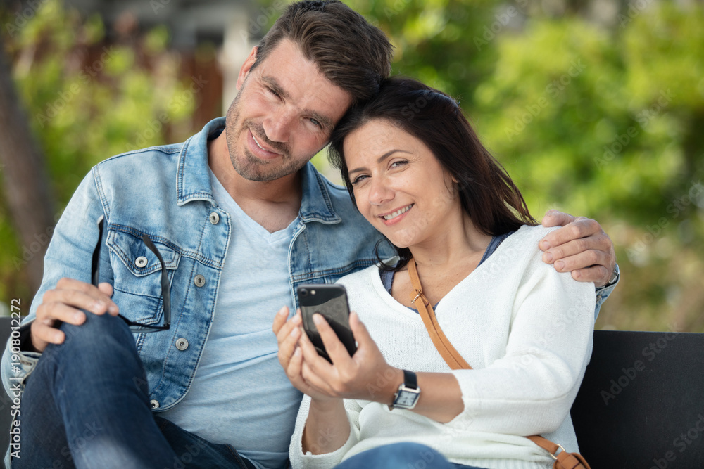 © auremar - couple sharing media in a smart phone © auremar - couple sharing media in a smart phone