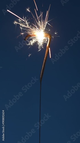 Wallpaper Mural 7 years celebration festive footage made with sparkler in the form of number Seven. Vertical composition. Torontodigital.ca