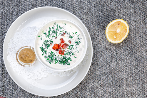 Traditional Eastern European Cold Okroshka Soup with Fish and Mustard