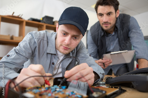 Quadro su tela electronics student being assessed doing a practical examination