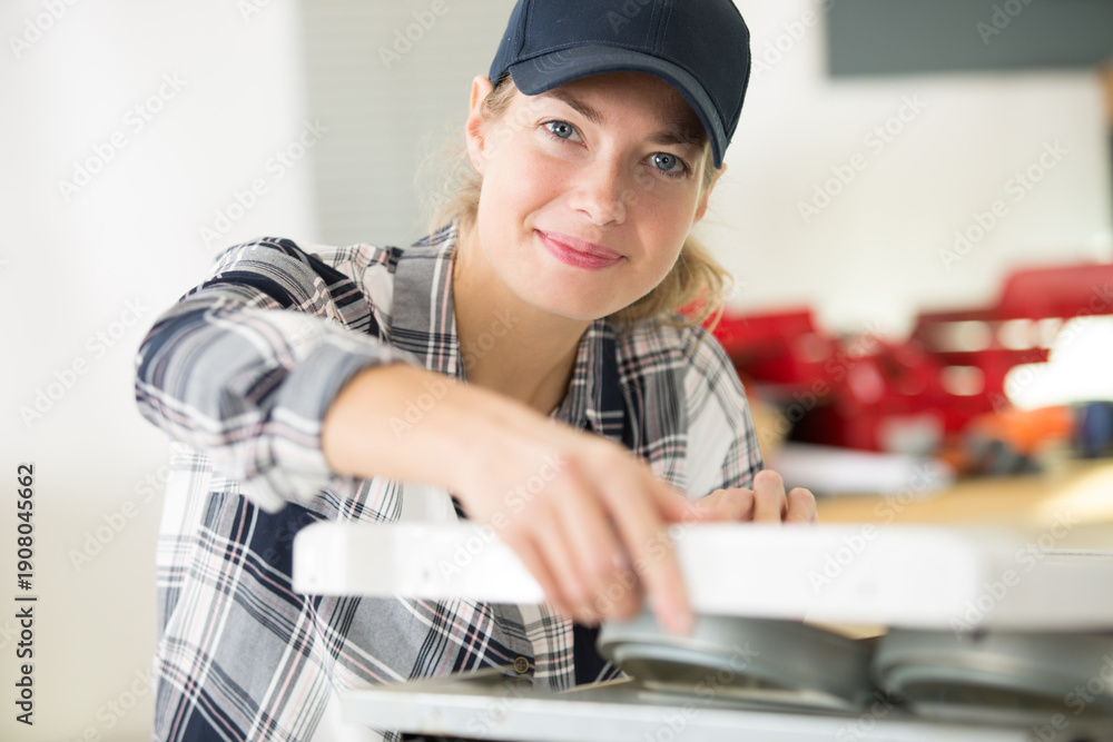 © auremar - portrait of female worker in kitchen