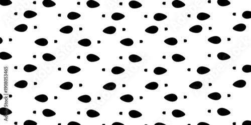 A dense, repeating pattern of black human footprints on a white background, suitable for texture or design.