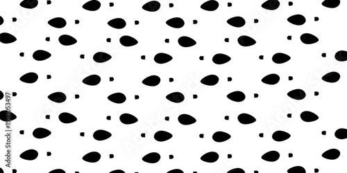 Collection of diverse black human footprints and shoe soles on a white background, graphic representation of walking and steps