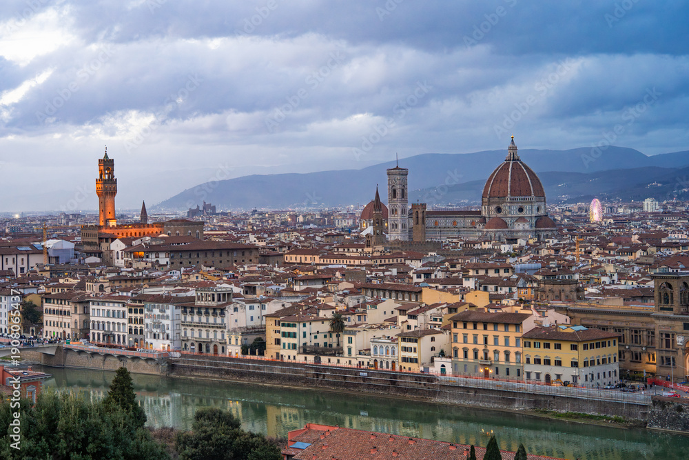 Obraz premium Panoramic view of historic Florence at sunset from Piazzale Michelangelo, capturing the city's golden hour beauty. Florence,Italy 03.01.2026 