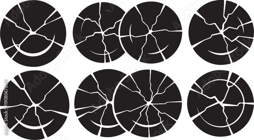 Cracked black circles with white lines on plain background
