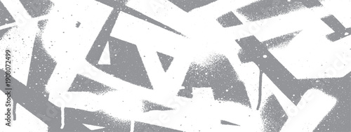 Abstract graffiti art on a wall in black and white.