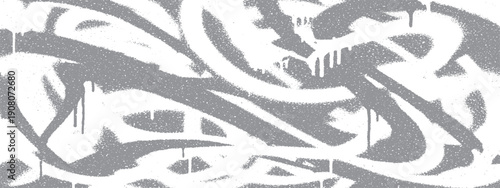 Abstract graffiti art with dynamic white paint strokes on a gray background.