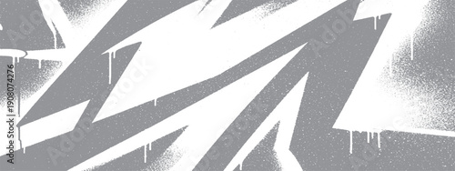 Abstract white graffiti strokes on a gray wall with dripping paint effect.