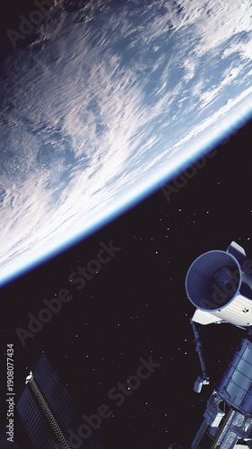 Vertical 3D animation of the space station in Earth orbit with a docked commercial spacecraft