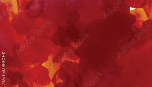 Abstract red and orange ink swirls in water