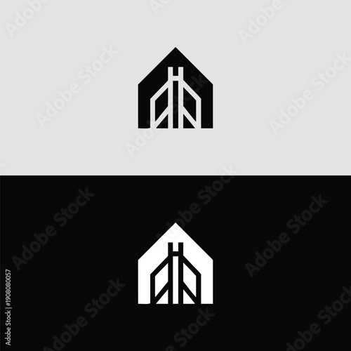 A solid, geometric black icon features a modern house or building containing abstract internal structural elements, effectively contrasted against light and dark backgrounds.