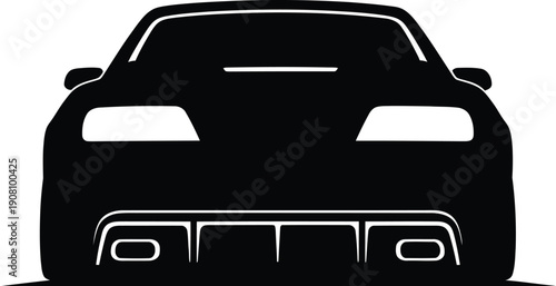 Rear view of a sleek sports car with glowing headlights on a dark road at night