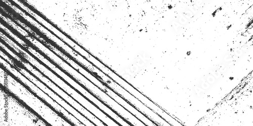 Black diagonal brush strokes and speckles on white textured background abstract