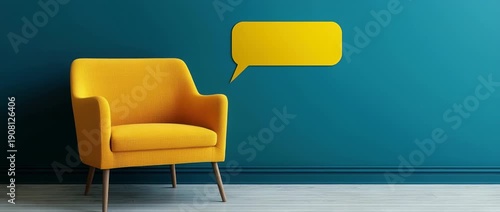 Yellow armchair next to teal wall with blank speech bubble copy space
