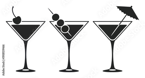 Three martini glasses with garnishes: cherry, olives, and umbrella